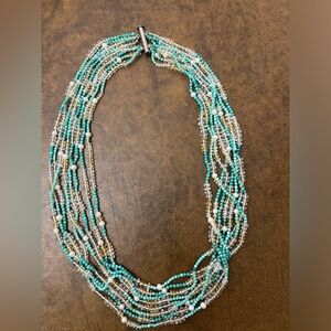 Sterling silver clasp with turquoise, crystal, & pearl beads. 8” diameter